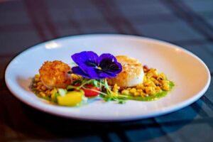 Pan seared sea scallops with Mexican street corn salsa and sweet pea purée